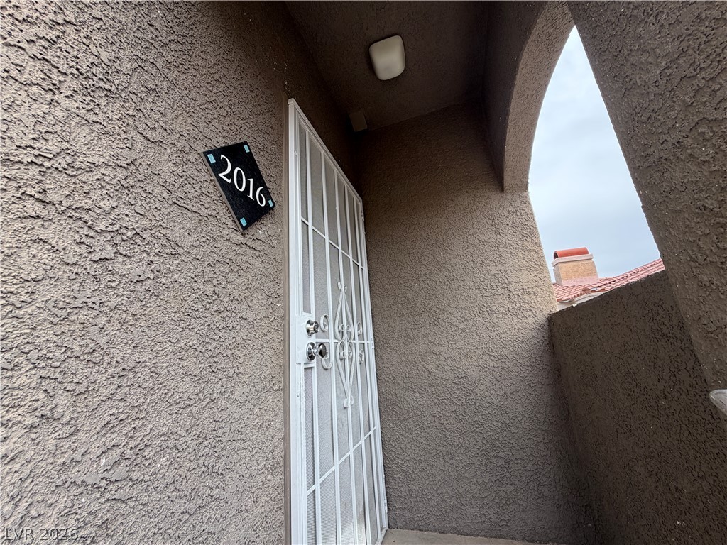 5525 West Flamingo Road, Unit 2016 Las Vegas, NV 89103 - Photo 4 of 20 View of exterior entry with stucco siding
