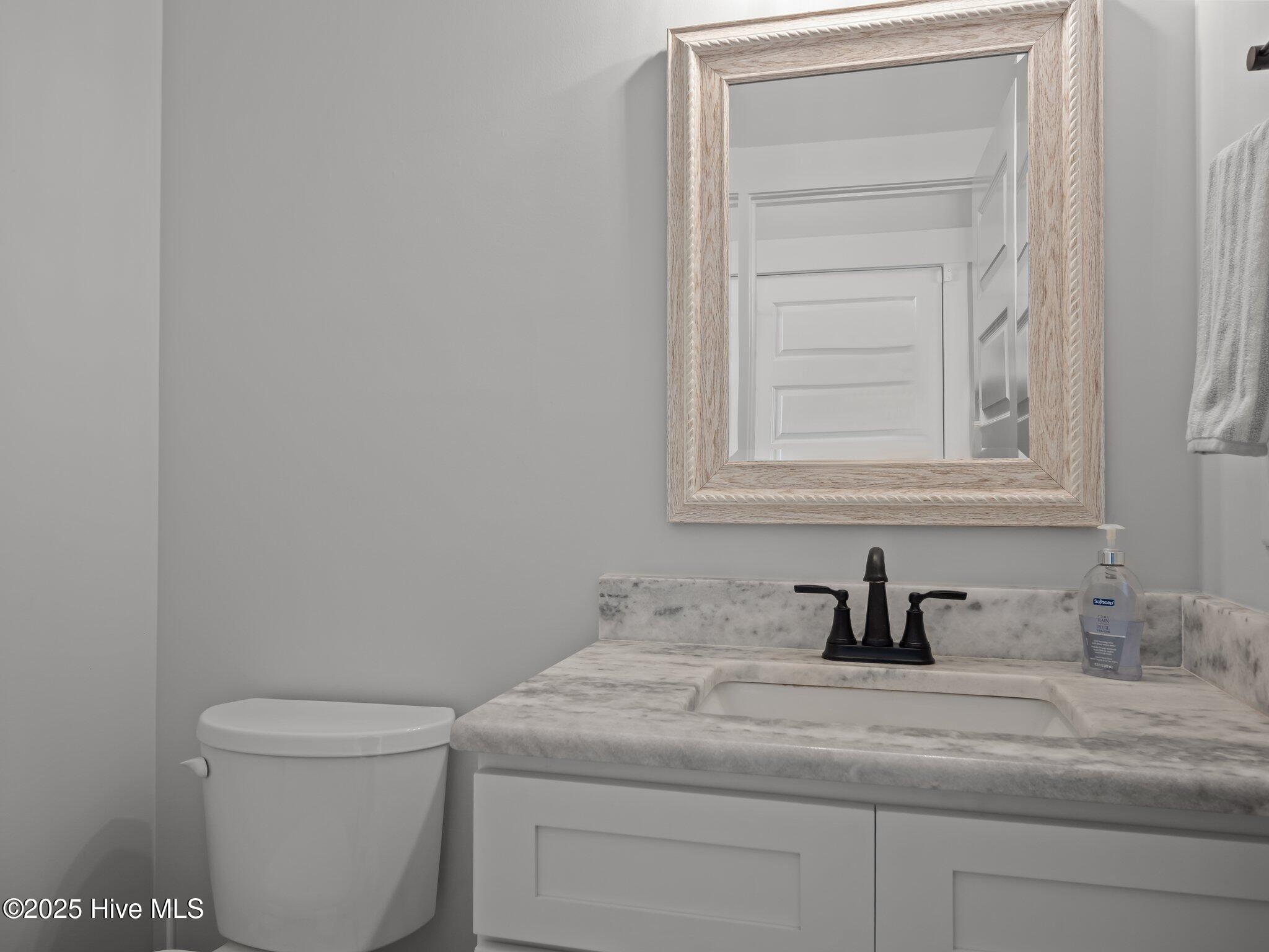 208 Coastline Circle Cedar Point, NC 28584 - Photo 27 of 66 Half Bath off garage