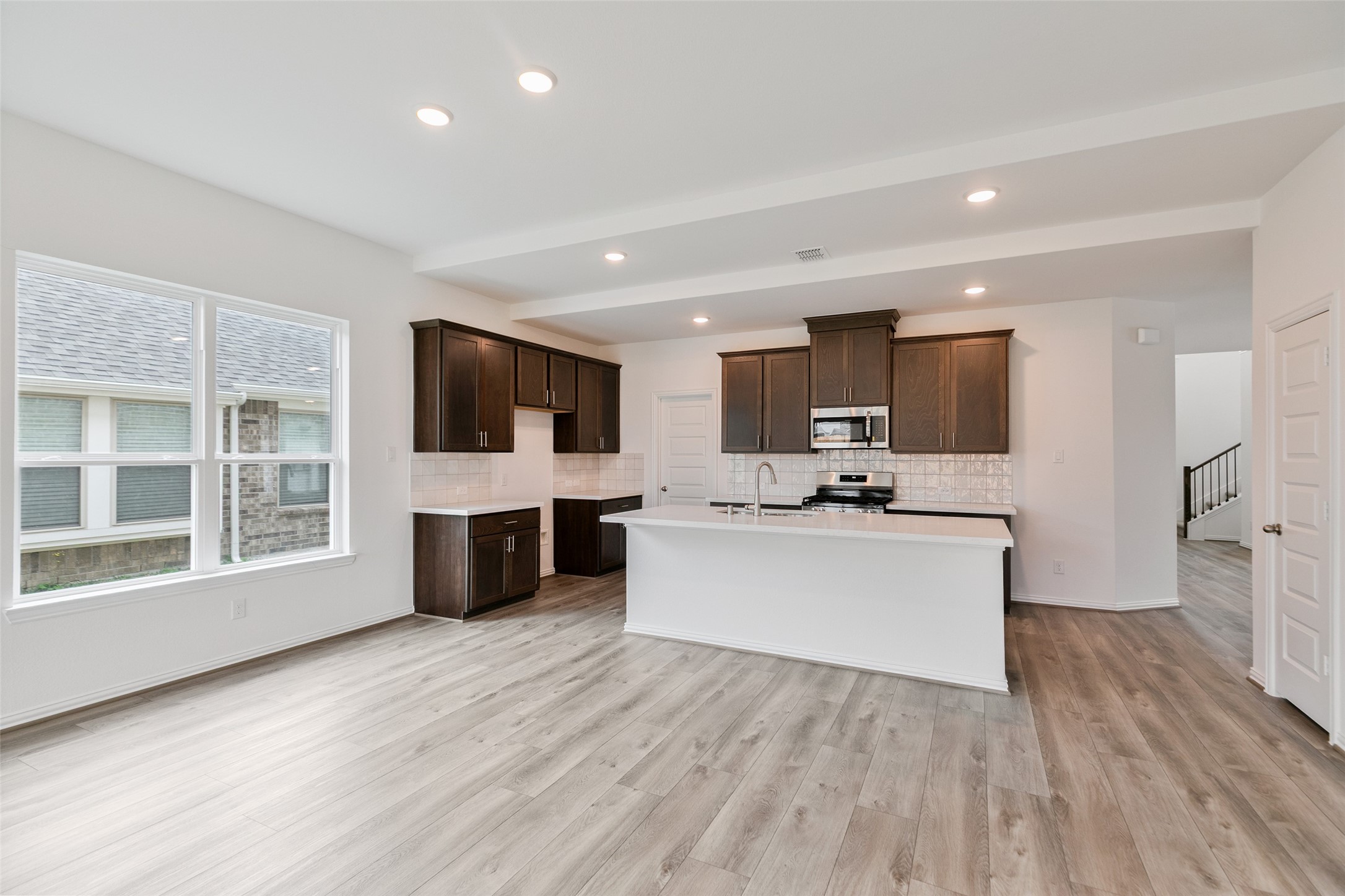 2710 Alexis Street Seabrook, TX 77586 - Photo 22 of 46 a view of kitchen with microwave refrigerator and cabinets