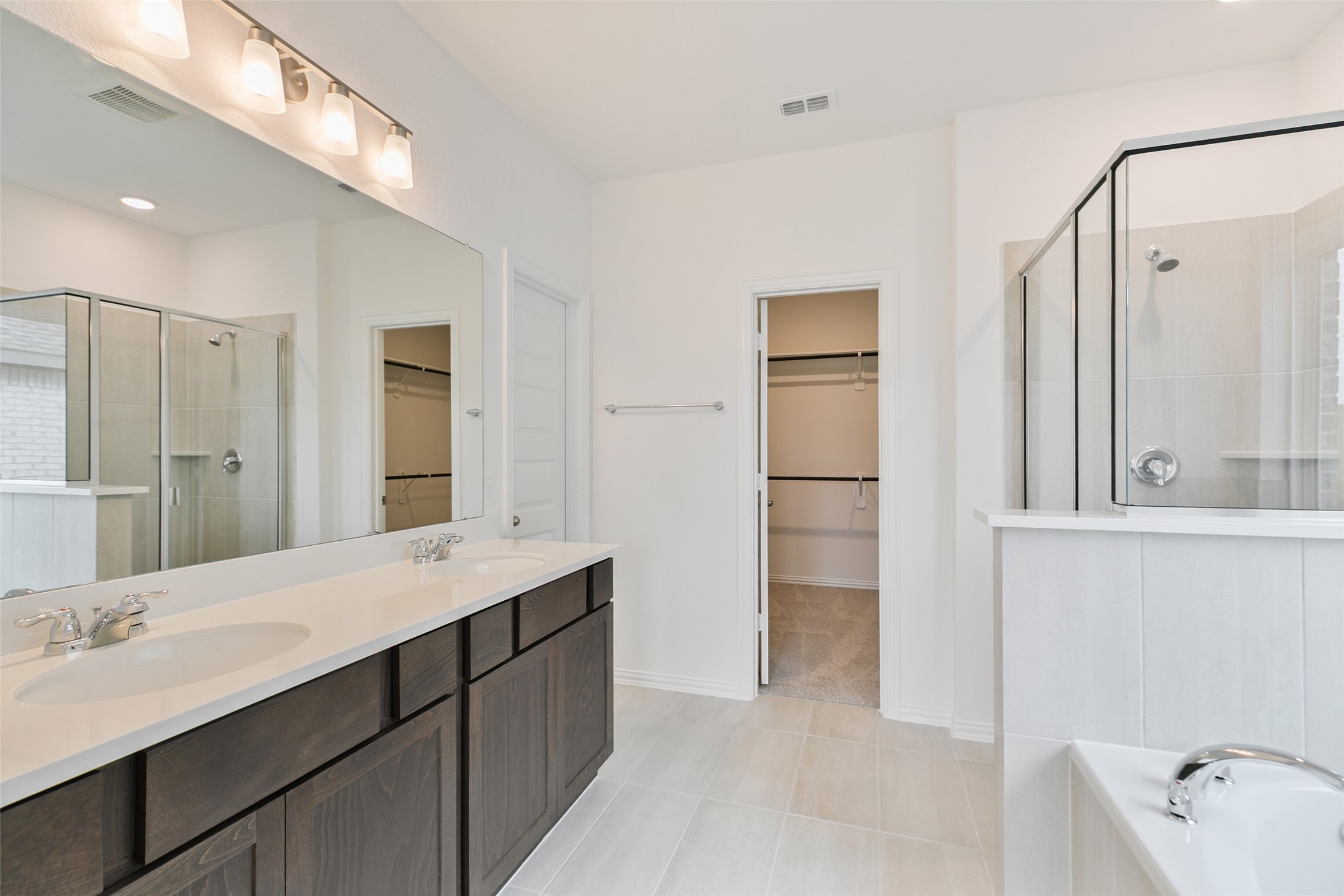 2710 Alexis Street Seabrook, TX 77586 - Photo 25 of 46 a bathroom with a double vanity sink and mirror