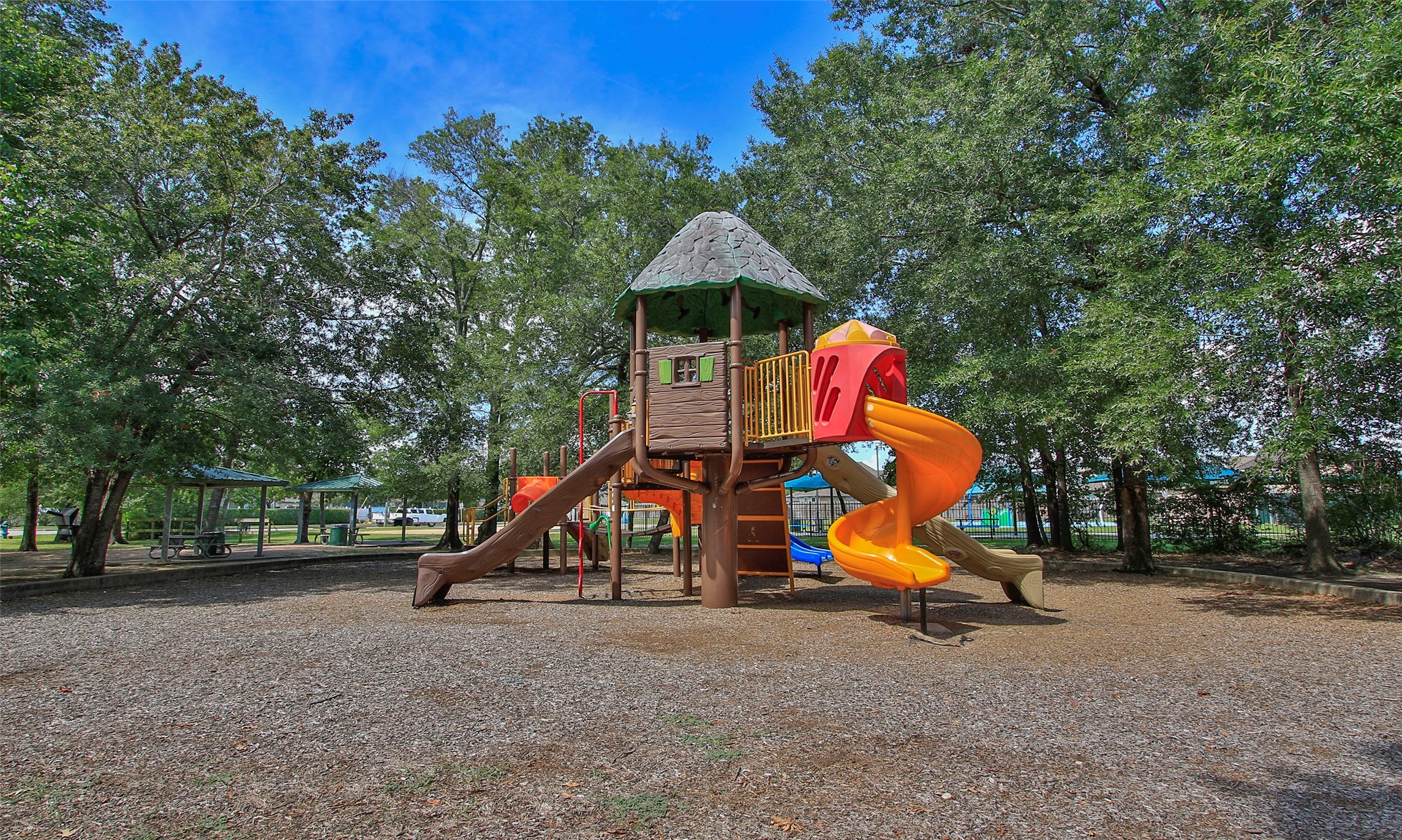 2710 Alexis Street Seabrook, TX 77586 - Photo 38 of 46 a wooden bench sitting in the middle of a park