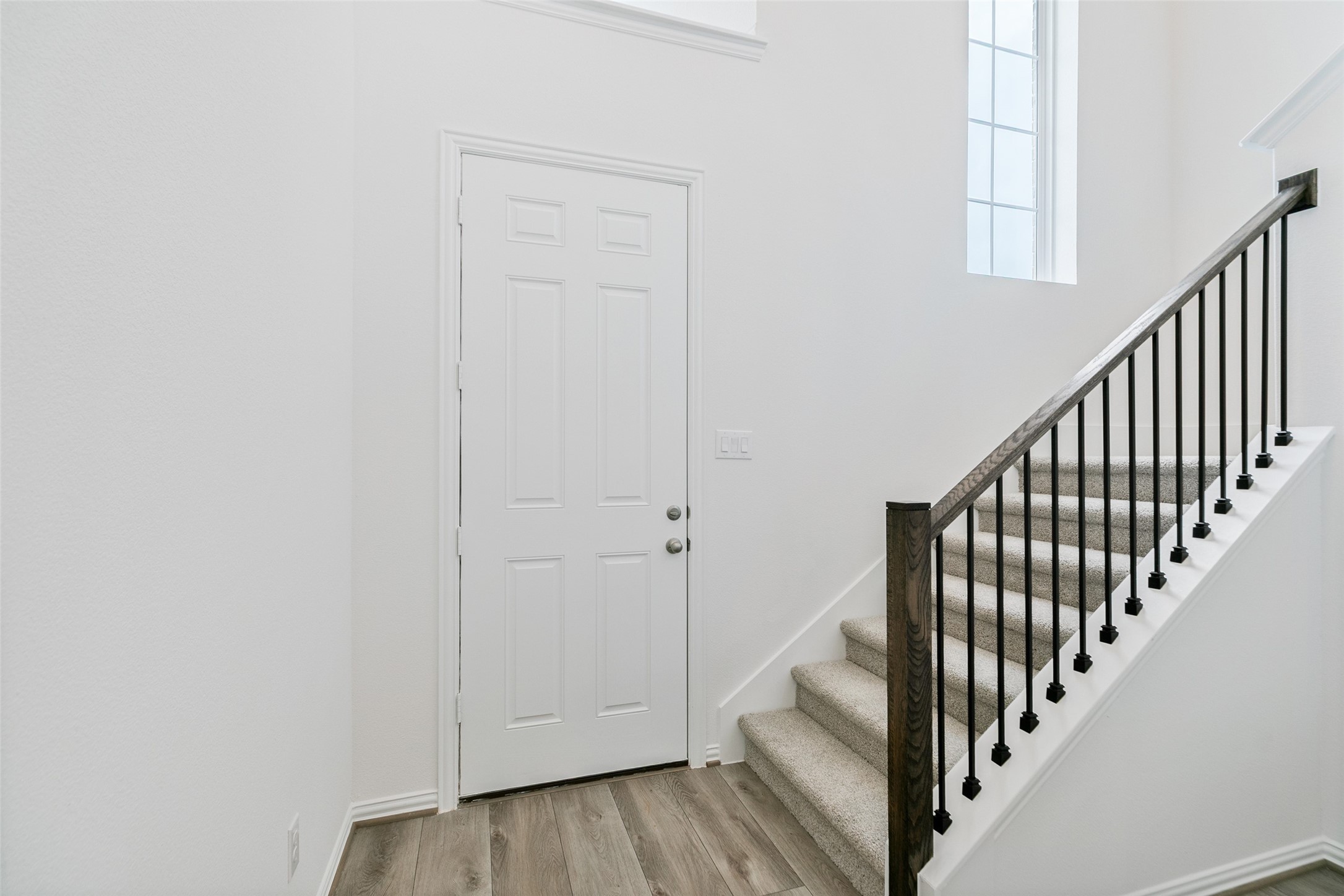 2710 Alexis Street Seabrook, TX 77586 - Photo 6 of 46 a view of staircase with wooden floor and white walls