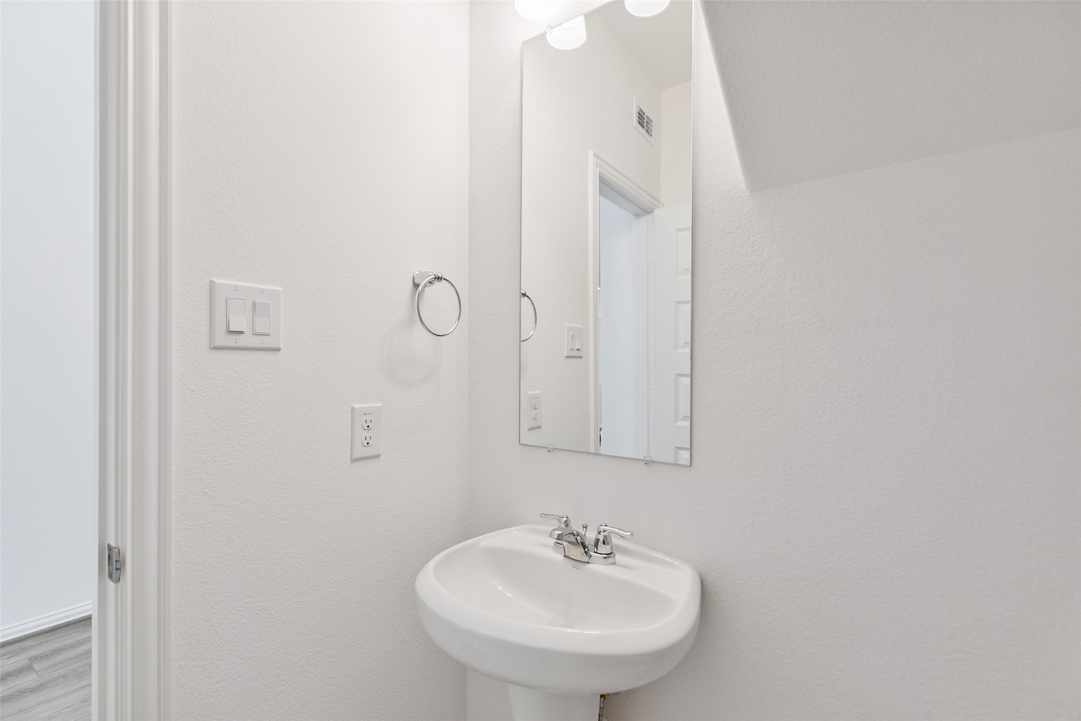 2710 Alexis Street Seabrook, TX 77586 - Photo 7 of 46 a bathroom with a sink and mirror