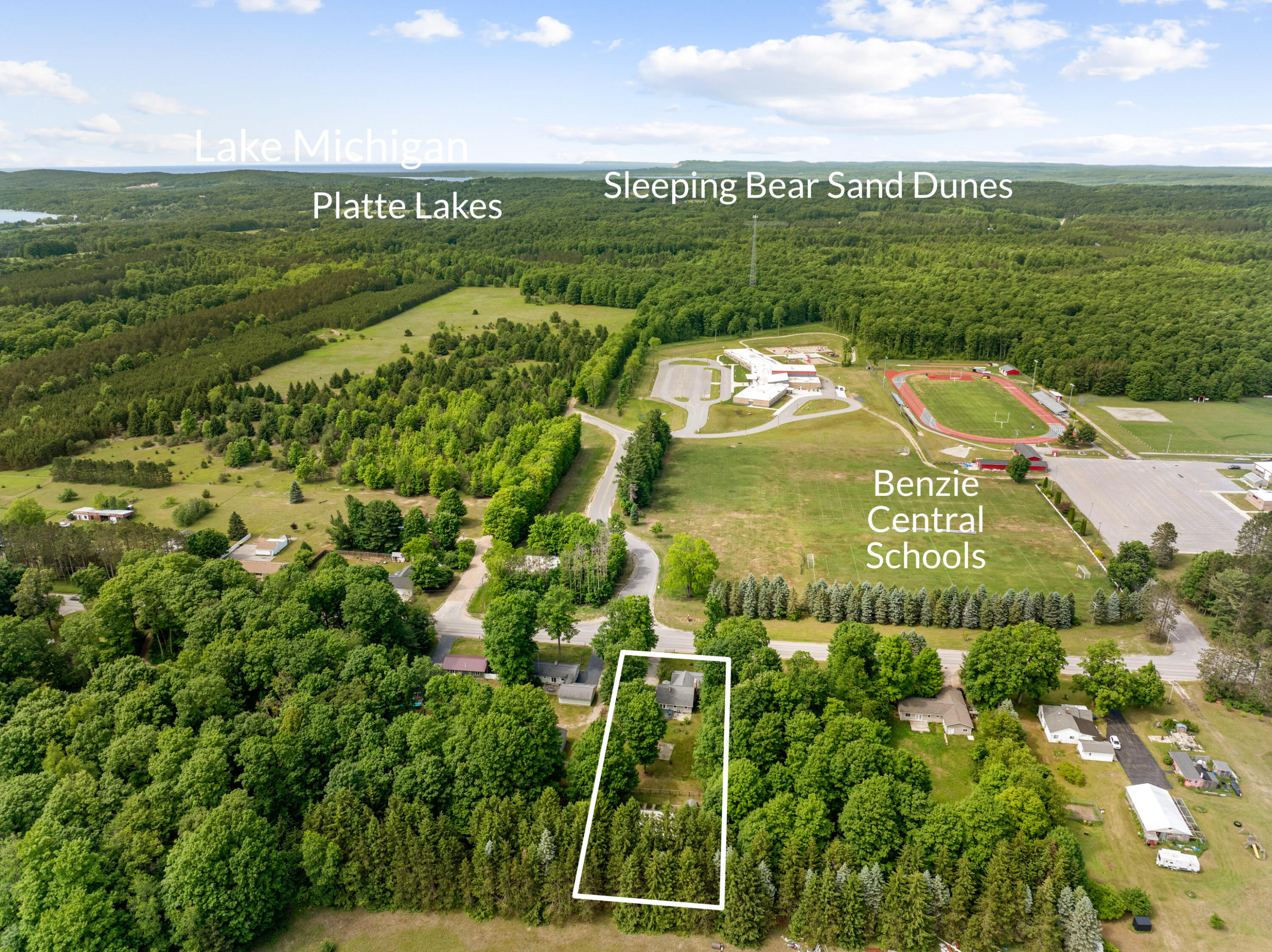 9055 Homestead Road Benzonia, MI 49616 - Photo 4 of 60 DJI_20260618161653_0230_D