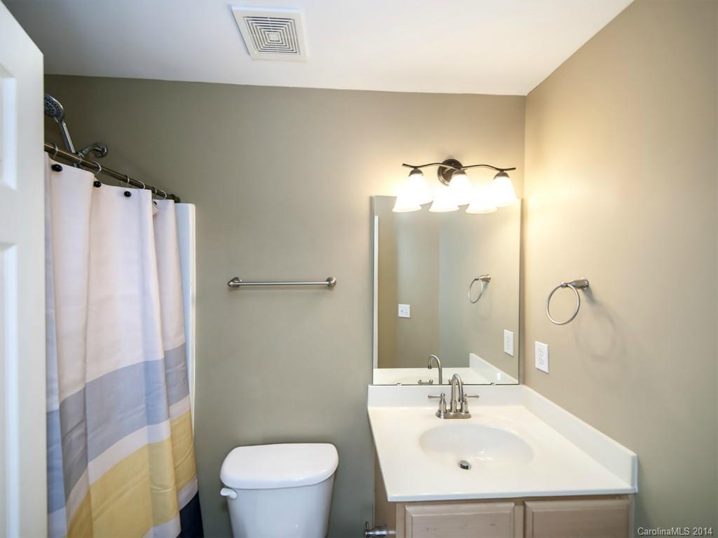 2146 Midnight Blue Lane Fort Mill, SC 29708 - Photo 14 of 19 a bathroom with a sink mirror and toilet
