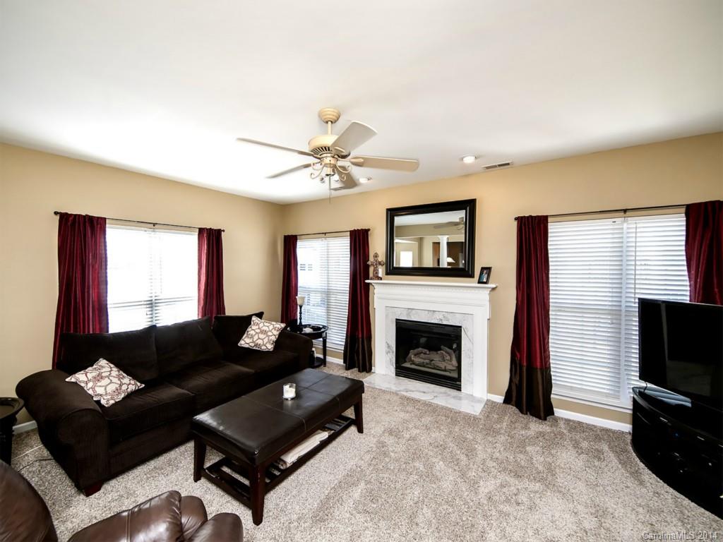 2146 Midnight Blue Lane Fort Mill, SC 29708 - Photo 8 of 19 a living room with furniture and a flat screen tv