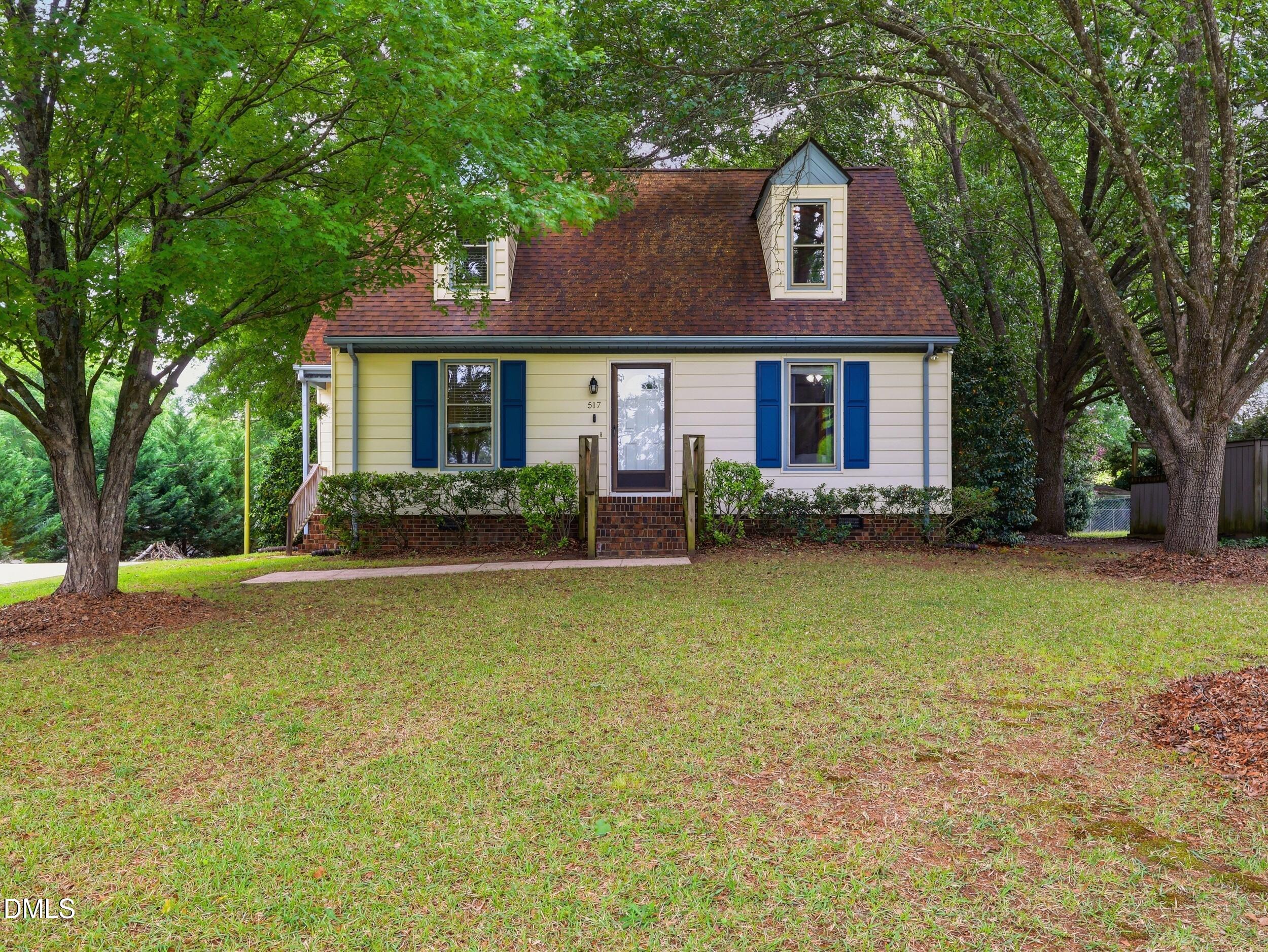 517 Lake Glad Road Wendell, NC 27591 - Photo 2 of 36 a front view of a house with garden