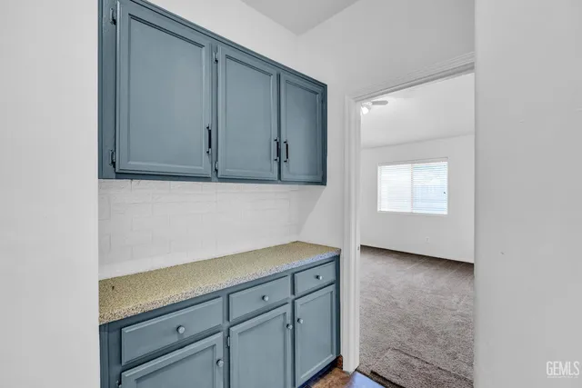 a view of cabinets with wooden floor