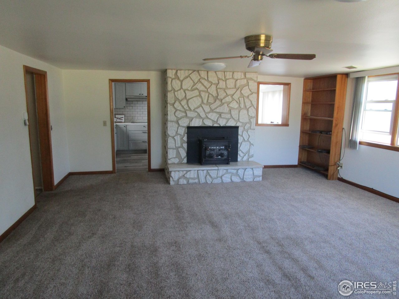 492 8th Street Burlington, CO 80807 - Photo 13 of 18 a view of a livingroom with a fireplace