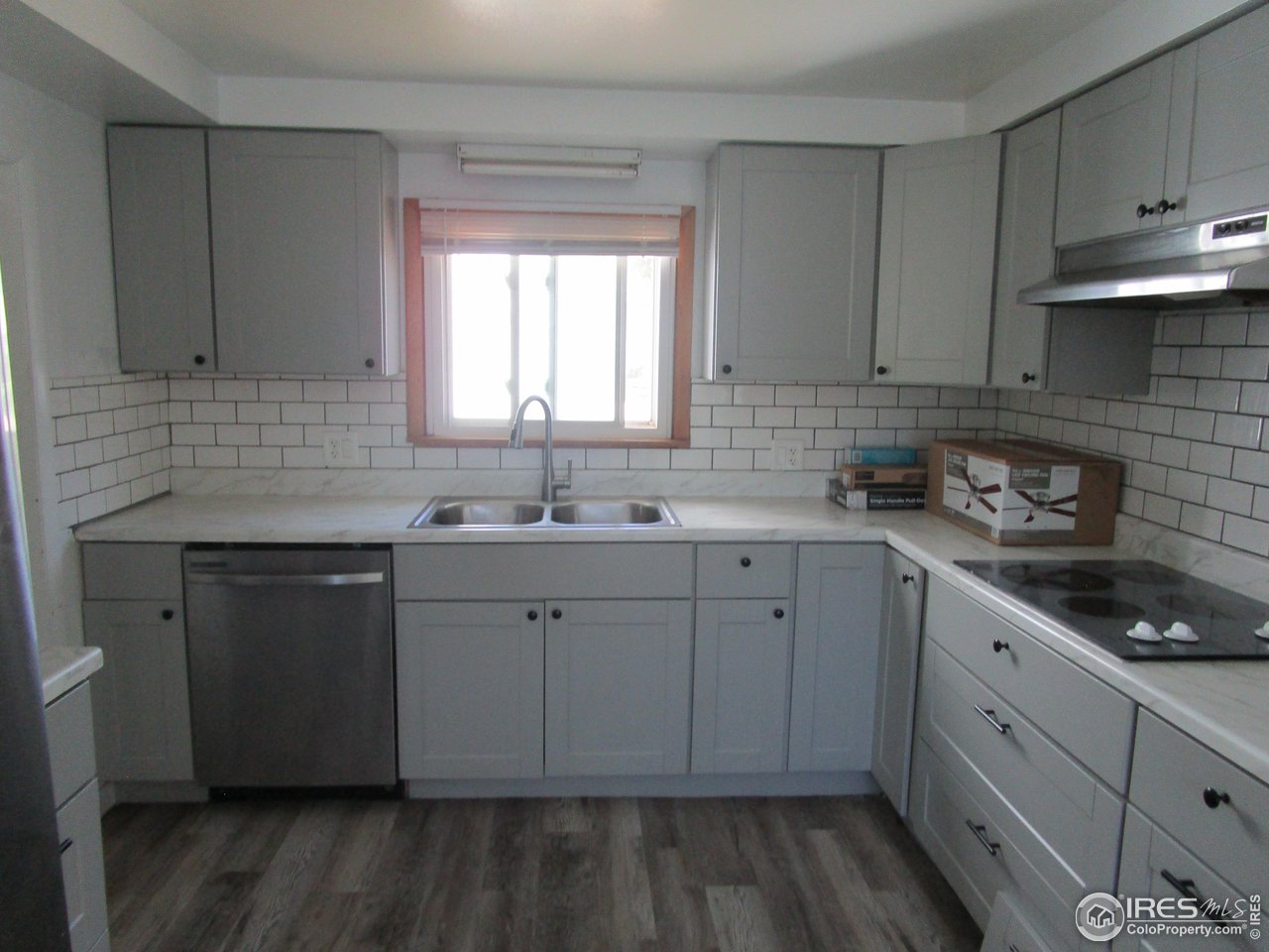492 8th Street Burlington, CO 80807 - Photo 7 of 18 a kitchen with sink cabinets and window