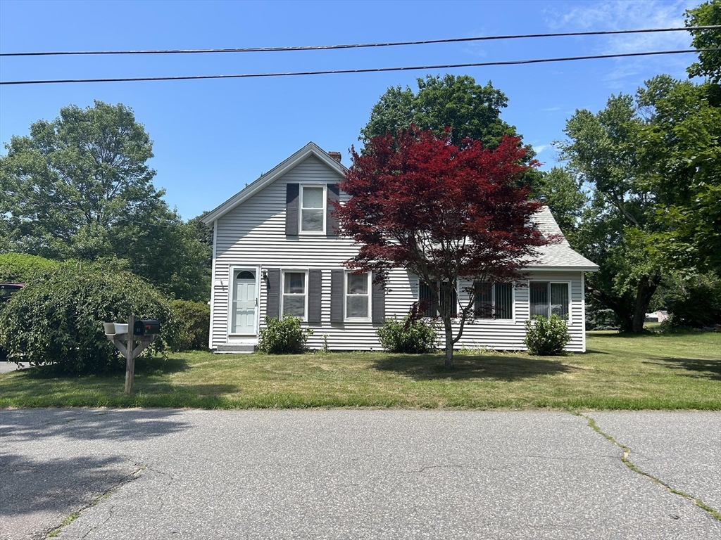 88 Shirley Road Lancaster, MA 01523 - Photo 1 of 31 a front view of a house with a garden
