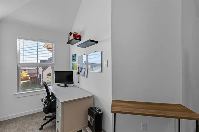 a bedroom with a bed and a closet with mirror