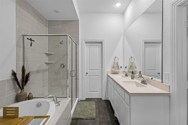 a bathroom with a tub and shower