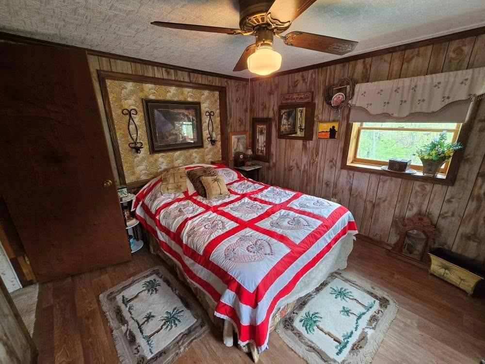4212 Dayton Road New Bethlehem, PA 16242 - Photo 24 of 31 a bed sitting in a bedroom next to a window
