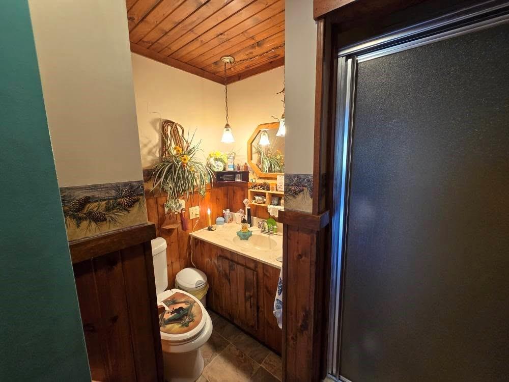 4212 Dayton Road New Bethlehem, PA 16242 - Photo 25 of 31 a bathroom with a sink and mirror with toilet