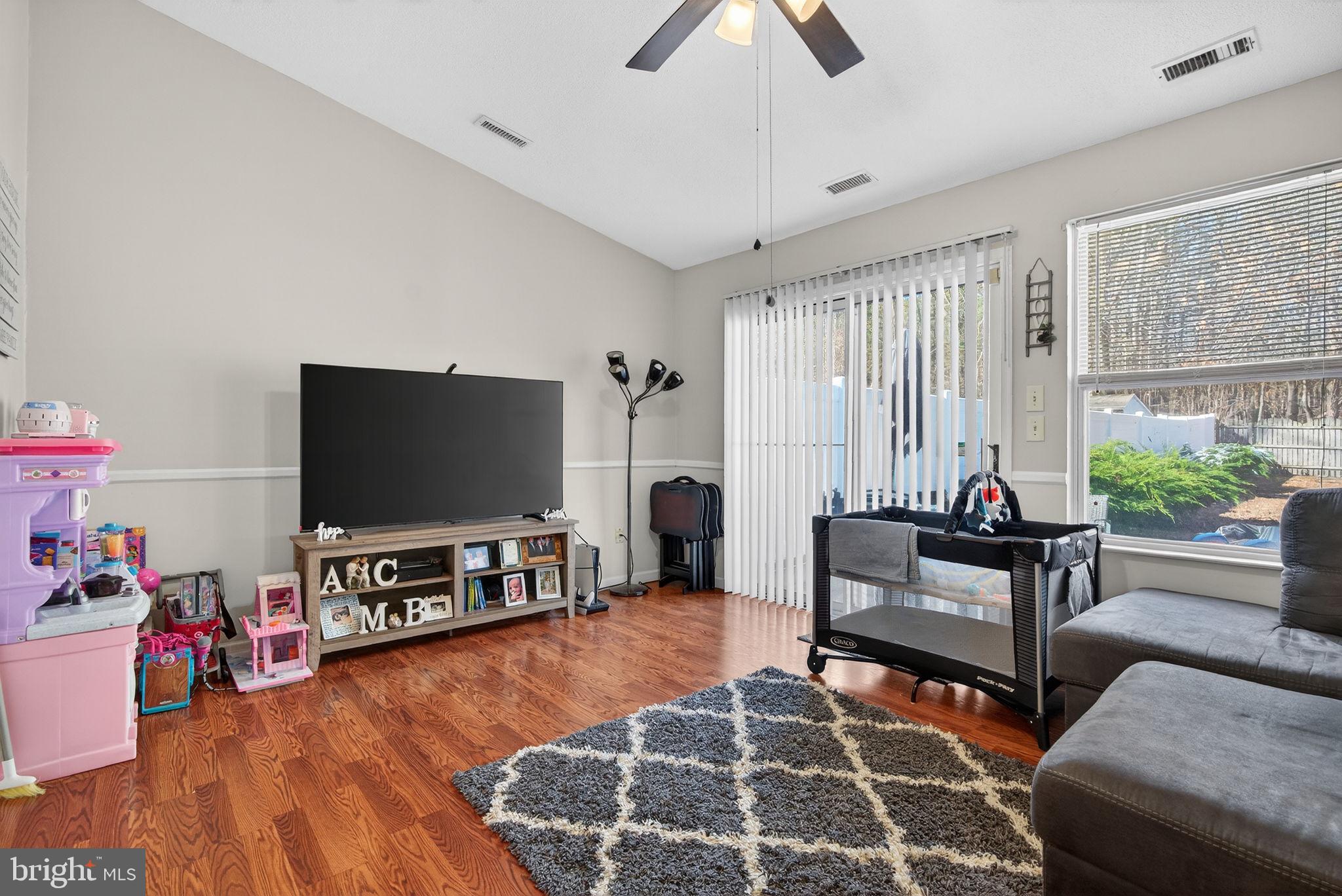 147 Baker Avenue Atco, NJ 08004 - Photo 12 of 31 a living room with furniture and a flat screen tv