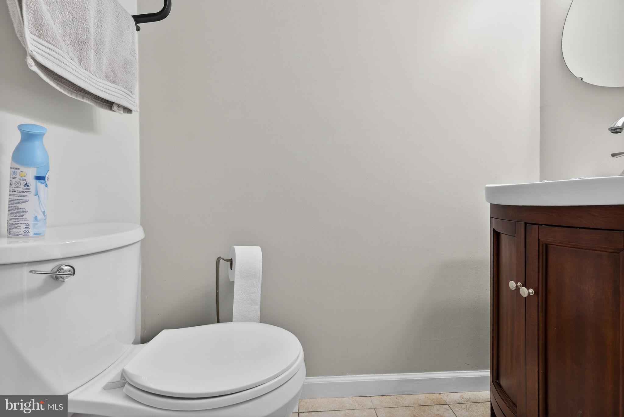 147 Baker Avenue Atco, NJ 08004 - Photo 15 of 31 a white toilet sitting next to a bathroom sink