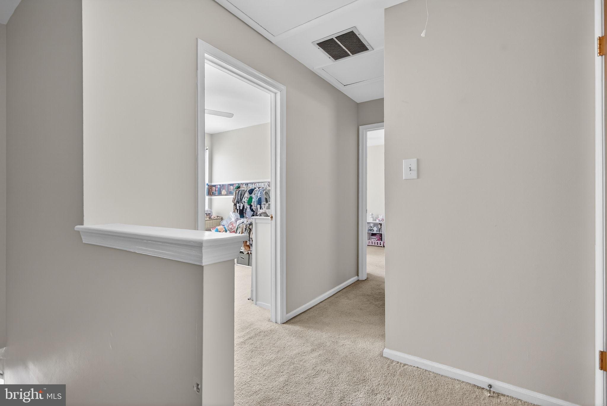 147 Baker Avenue Atco, NJ 08004 - Photo 18 of 31 a view of a hallway with wooden shelves