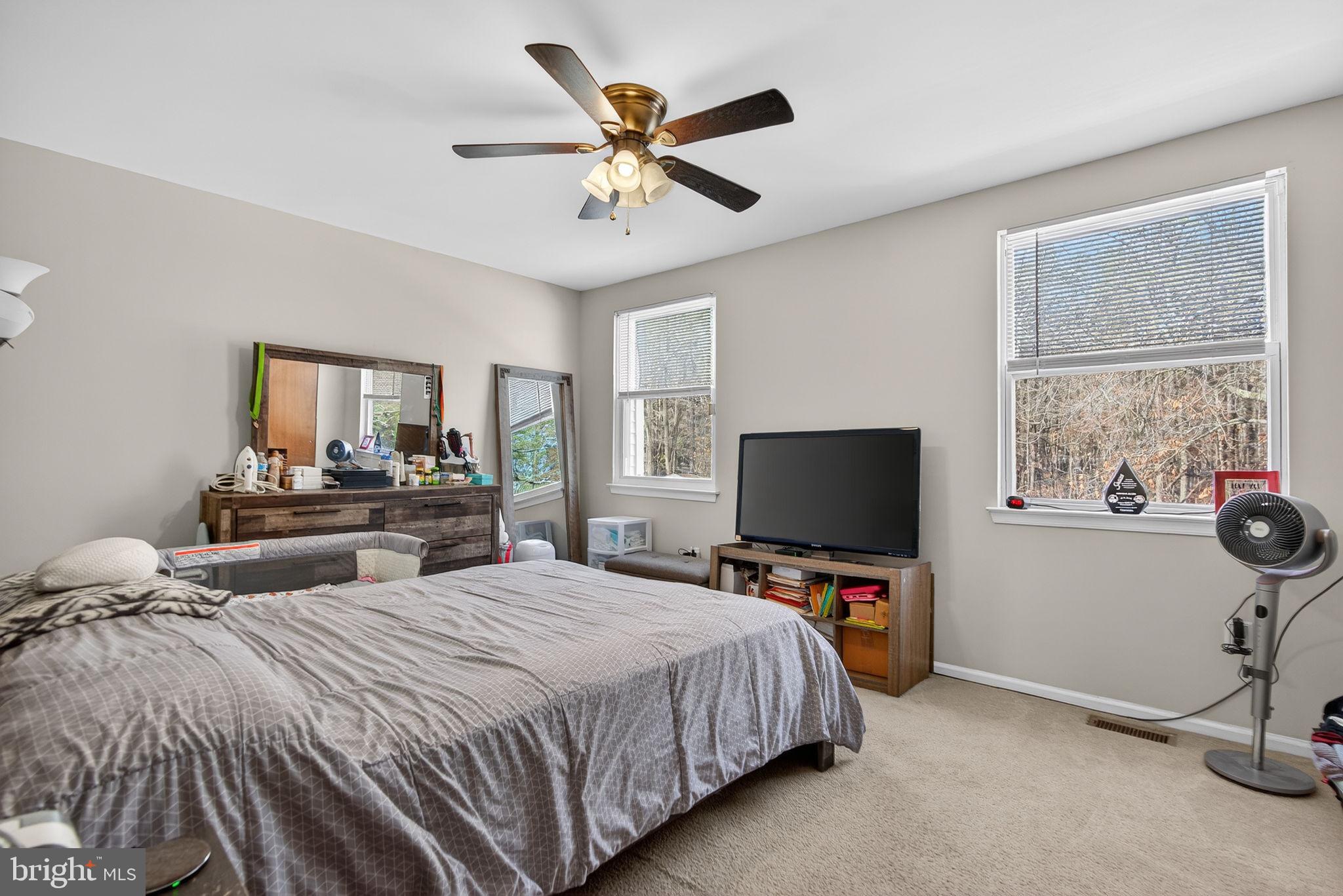 147 Baker Avenue Atco, NJ 08004 - Photo 19 of 31 a bedroom with a bed and a flat screen tv