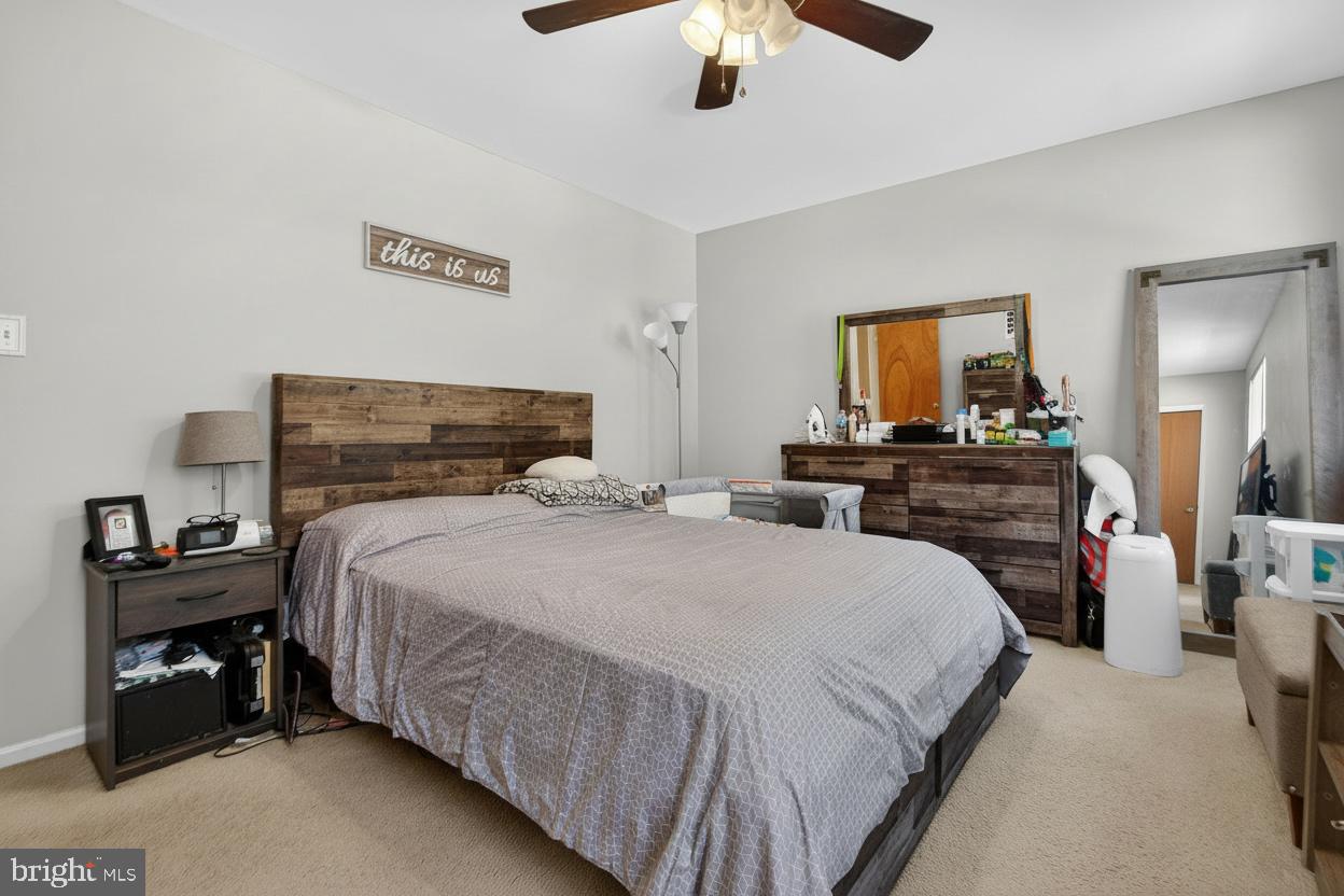 147 Baker Avenue Atco, NJ 08004 - Photo 20 of 31 a bedroom with a bed and a flat tv screen on dresser