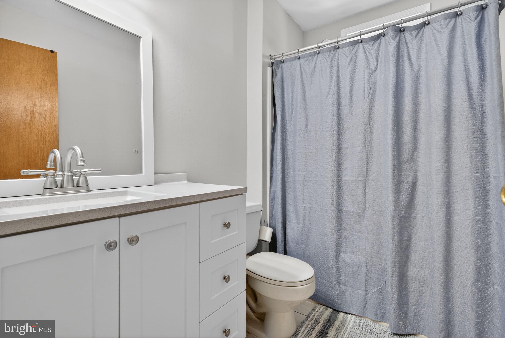 147 Baker Avenue Atco, NJ 08004 - Photo 21 of 31 a bathroom with a toilet a sink and a mirror