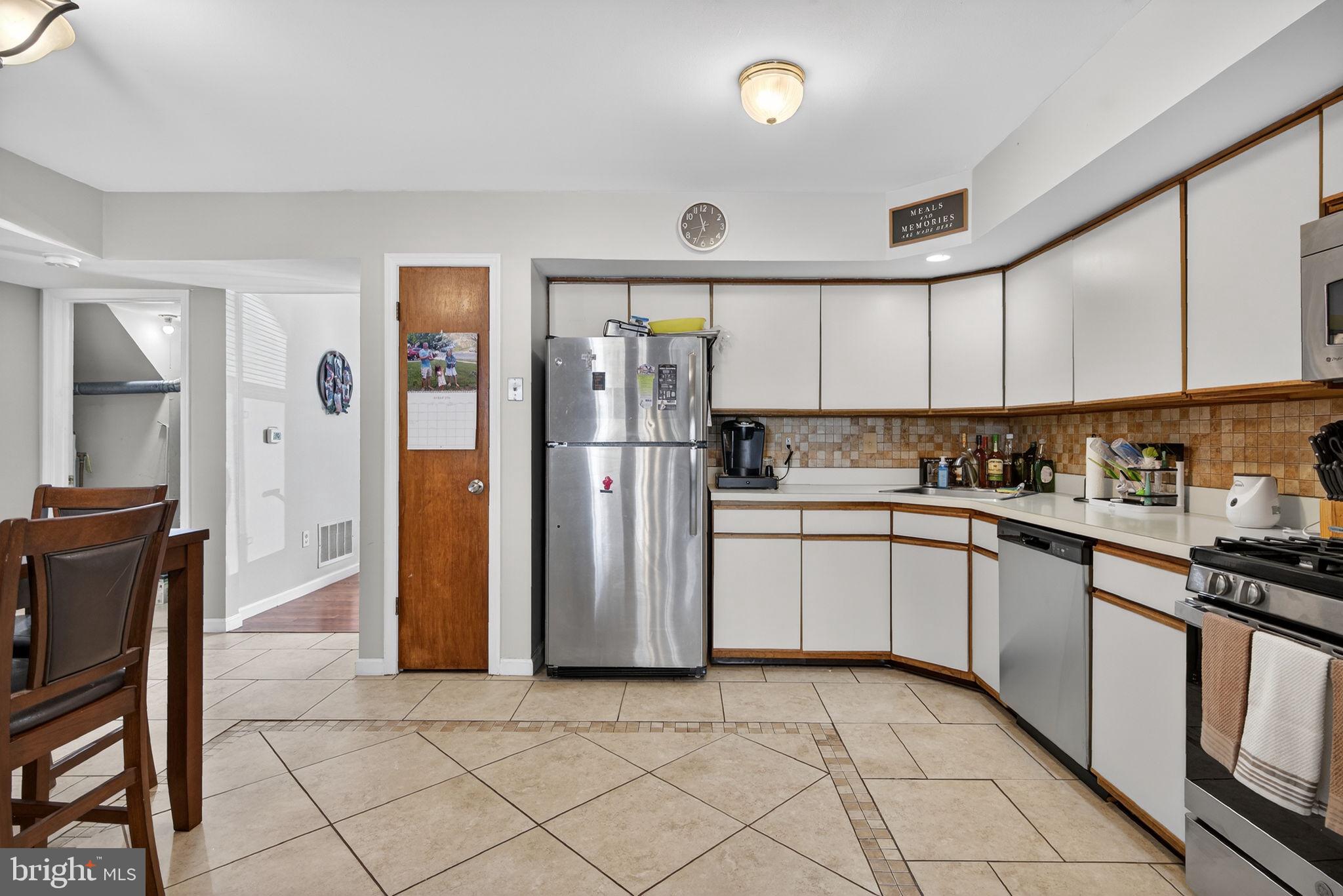 147 Baker Avenue Atco, NJ 08004 - Photo 10 of 31 a kitchen with stainless steel appliances granite countertop a refrigerator and a sink