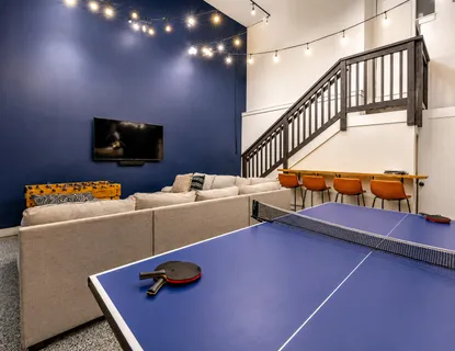 a view of living room with furniture and wooden floor
