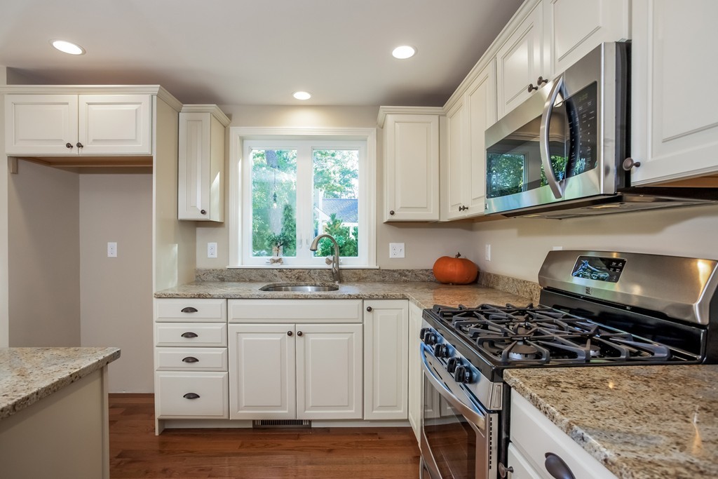 321 Cap'n Lijah's Road Barnstable, MA 02632 - Photo 2 of 10 a kitchen with stainless steel appliances granite countertop a stove a sink and a microwave