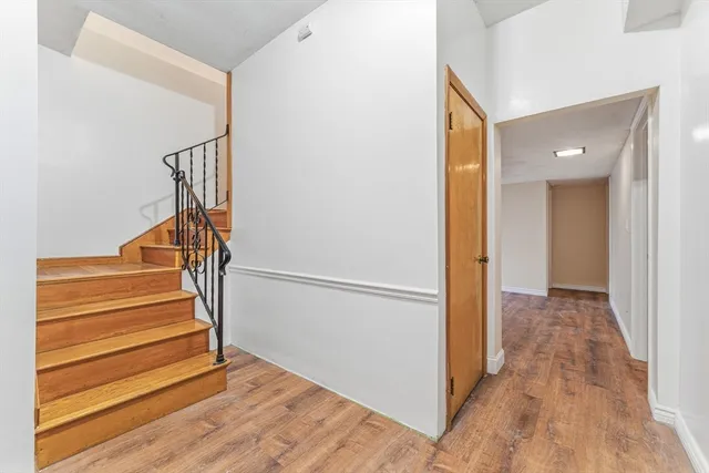 a view of entryway with wooden floor