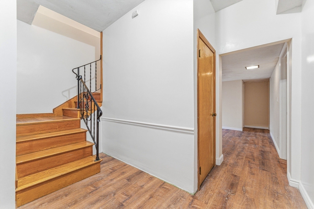 7 Carol Street Stoneham, MA 02180 - Photo 16 of 28 a view of entryway with wooden floor