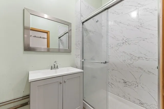 a bathroom with a sink and mirror