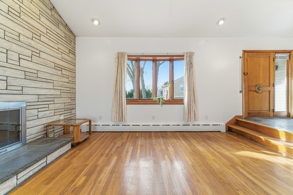 7 Carol Street Stoneham, MA 02180 - Photo 4 of 28 a view of a room with wooden floor and a sink