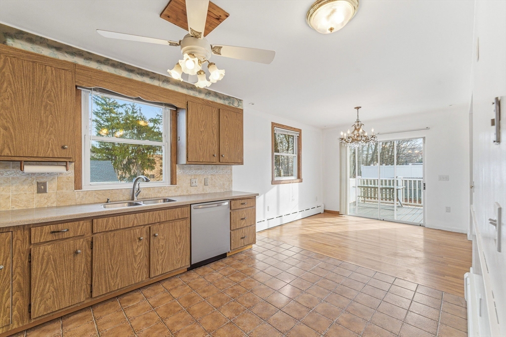 7 Carol Street Stoneham, MA 02180 - Photo 7 of 28 a view of a double vanity sink a mirror and a window