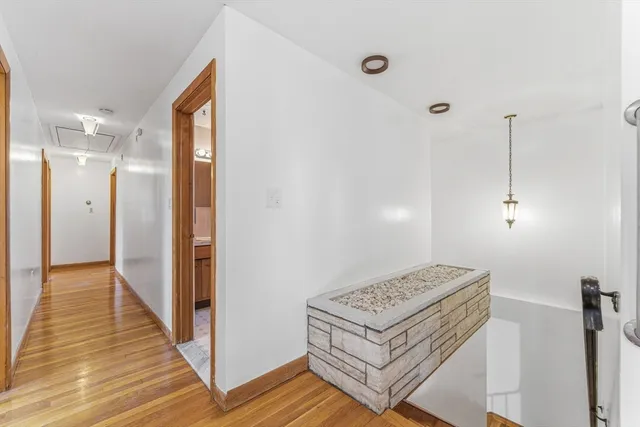 a view of a room with a furniture and wooden floor