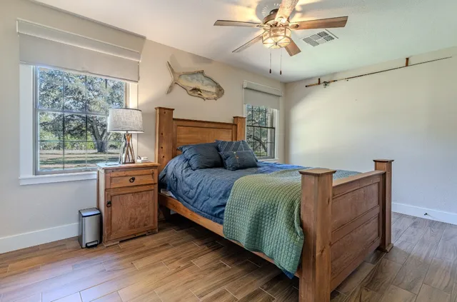 a bedroom with a bed and a mirror