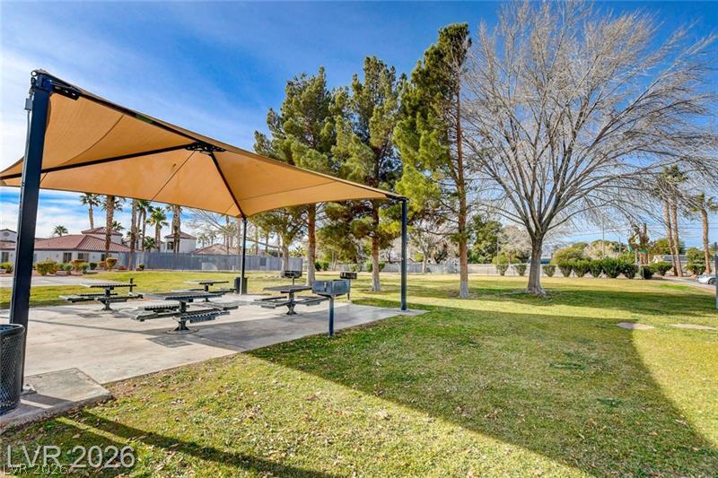 3318 North Decatur Boulevard, Unit 2152 Las Vegas, NV 89130 - Photo 44 of 58 Gather for al fresco meals in this well-maintained community picnic area with shading and grills.