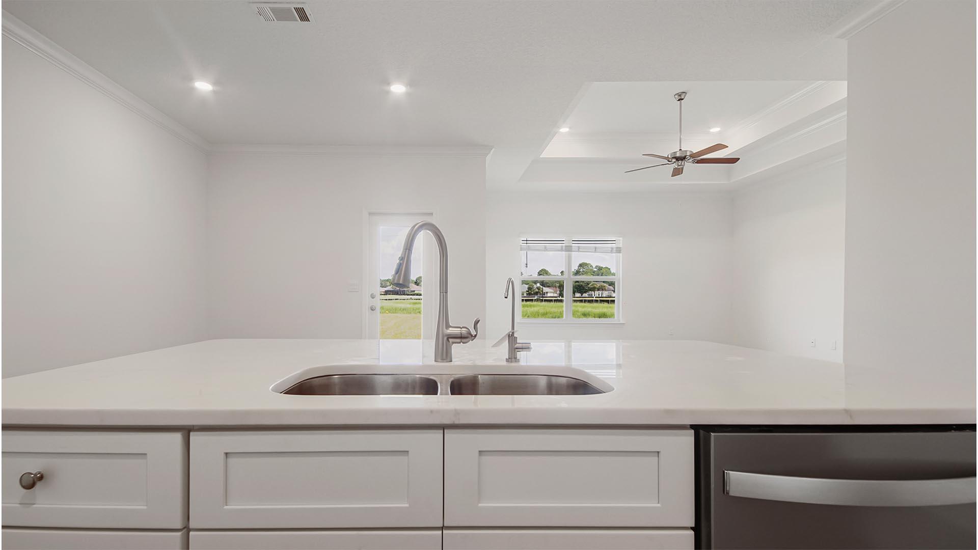 363 Holley Grv Lane Santa Rosa Beach, FL 32459 - Photo 15 of 37 a kitchen with a sink cabinets and window