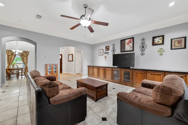 a living room with furniture and a flat screen tv
