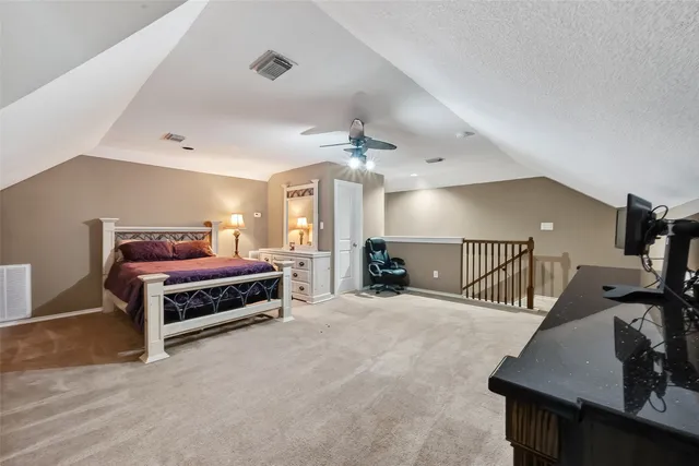 a bedroom with a bed and a table in it