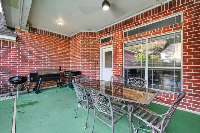 a view of a chairs and tables in patio