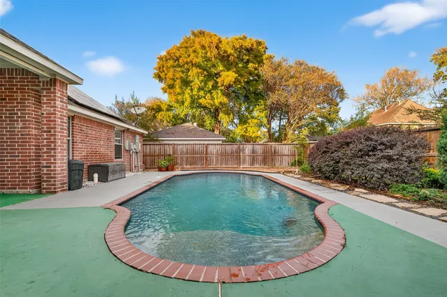 a view of outdoor space and swimming pool