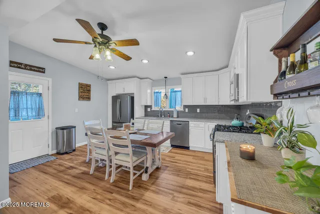 a kitchen with a table and chairs in it