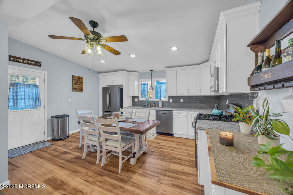 7 Maple Lane Howell, NJ 07731 - Photo 13 of 32 a kitchen with a table and chairs in it