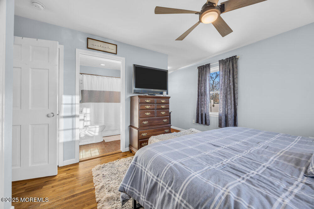 7 Maple Lane Howell, NJ 07731 - Photo 17 of 32 a bedroom with a bed and wooden floor