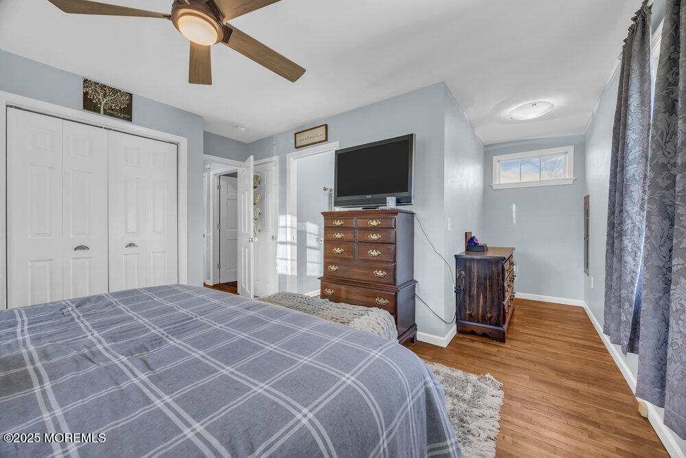 7 Maple Lane Howell, NJ 07731 - Photo 18 of 32 a bedroom with a bed and a flat screen tv