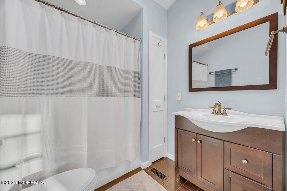 7 Maple Lane Howell, NJ 07731 - Photo 19 of 32 a bathroom with a sink and a mirror