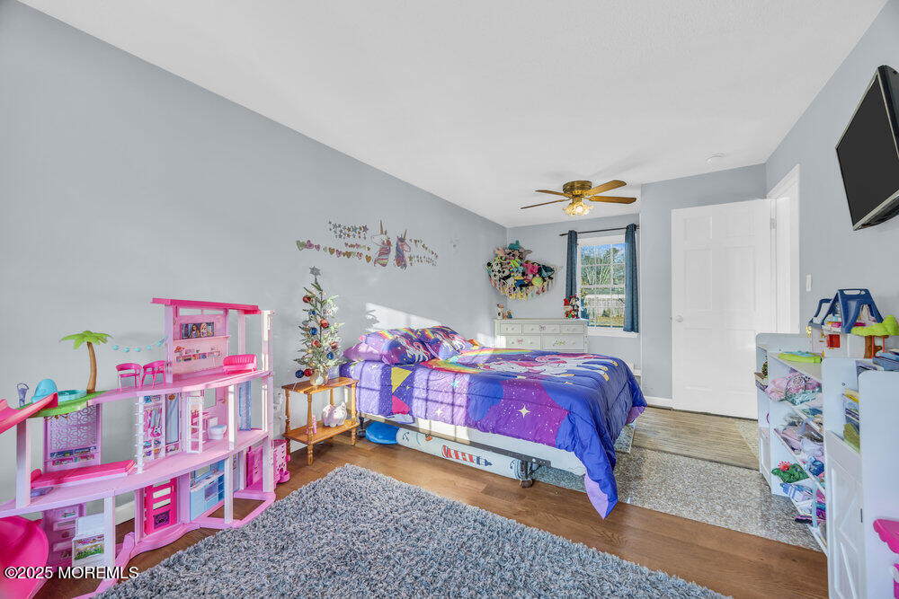 7 Maple Lane Howell, NJ 07731 - Photo 21 of 32 a bedroom with furniture and a couch