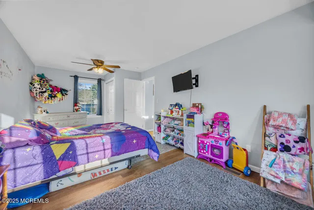 a bedroom with a bed and a couch