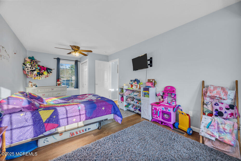 7 Maple Lane Howell, NJ 07731 - Photo 22 of 32 a bedroom with a bed and a couch