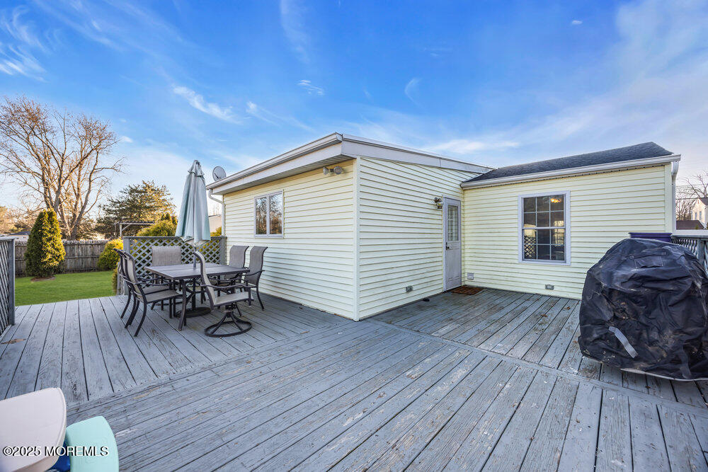 7 Maple Lane Howell, NJ 07731 - Photo 27 of 32 a view of a house with a patio and wooden floor